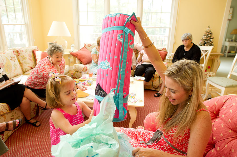 Bride opens gifts at her bridal shower in new seabury at cape cod.