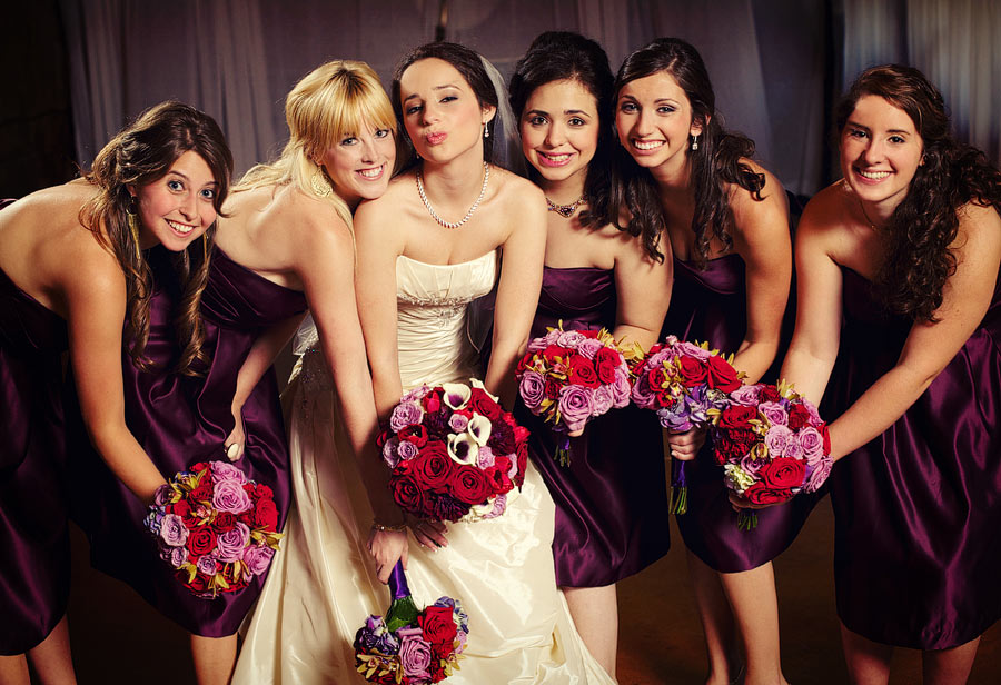 Red roses, plum bridesmaids dresses
