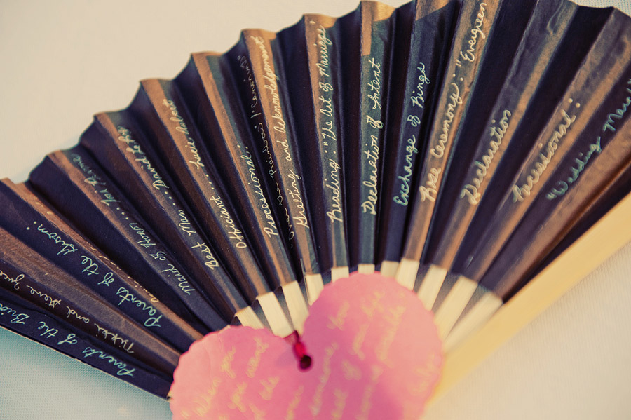 Wedding ceremony program on a hand held fan. hand written